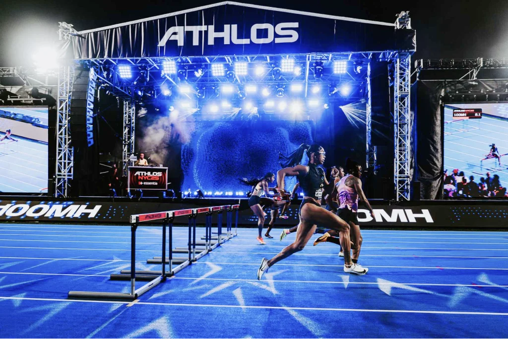Athletes competing at night at the Athlos 776 Invitational